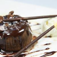 Chocolate Soufflé · Warm chocolate sponge cake. Served with vanilla ice cream.