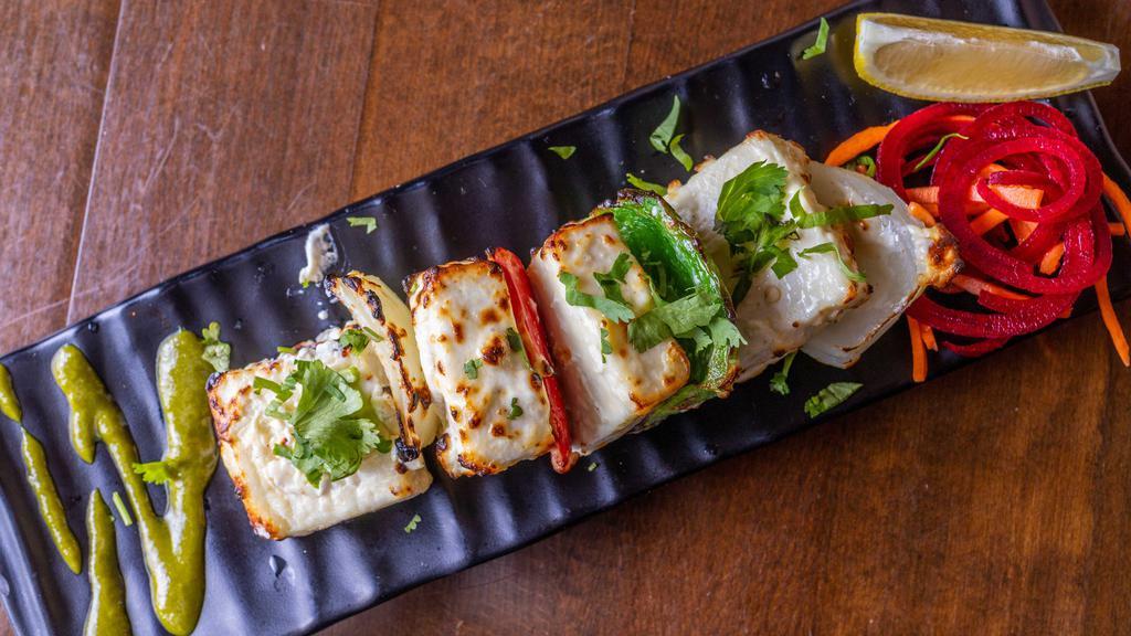Malai Paneer Tikka · Marinated cottage cheese tandoori grilled, with onions and bell peppers.