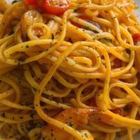 Shrimp Scampi · Shrimp seared over linguine. Served with garlic, oil, and cherry tomatoes..