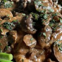 Vitello Florio · Veal scaloppini sautéed with mushrooms and finished in a light Marsala wine glaze..