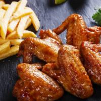 Bbq Wings With Fries · Pub-style bbq wings with our double fry method served with fresh cut french fries.