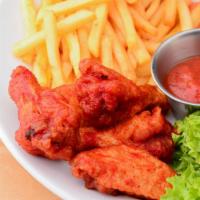 Buffalo Chicken Tenders With Fries · Fresh hand-breaded, golden-fried chicken tenders smothered in buffalo sauce served with fres...