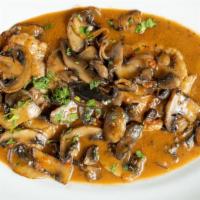 Veal Marsala · with mushrooms.