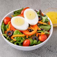 Garden Salad Bowl · Fresh mixed greens, cherry tomatoes, olives, peppers and boiled egg.
