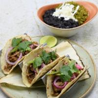 Carnitas · Slow-roasted heritage pork, green chile salsa, pickled red onion. Gluten-free. Classic: on h...