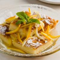 Galactobureco · Semolina custard in phyllo, Greek honey, and orange zest syrup.