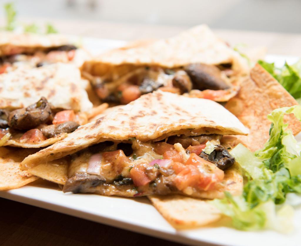 Mexican Squash Saute  Quesadilla · OXIDO's tasty grilled cheese and toasted goodness. A tortilla filled with Monterey jack, salsa fresca and chipotle crema.