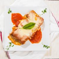 Eggplant Rollatini · Three Egg-battered eggplant, stuffed with fresh Ricotta cheese and topped with our tomato sa...