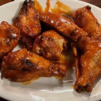 Chicken Wings · On the bone tossed in our barbecue or spicy buffalo sauce.