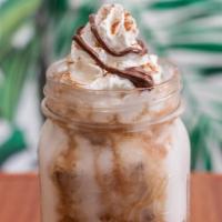 Iced Sweet Aloha · double espresso shot, choice of milk, dark monin chocolate, organic local honey 
topped with...