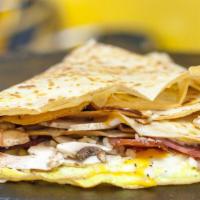 Breakfast Of Champion Crepe · Most popular. Scrambled eggs, cheese bacon, mushrooms, spinach and garlic.
