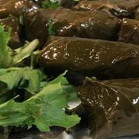 Grape Leaves App · 10 pieces. Made of rice and oregano. Served with a side of Taziki Sauce. Vegetarian.