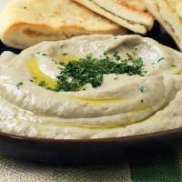 Baba Ghanoush App · Puree made from roasted eggplant blended with our special herbs. Served with Fresh pita bread.
