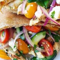 Chicken Greek Pita · Grilled chicken & a Greek salad (Lettuce, tomatoes, red roasted peppers,. cucumbers, Greek f...