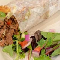 Lamb Shawarma Pita · Marinated minced meat with Lettuce, tomatoes, onions, pickles, parsley & sesame seed tahini ...
