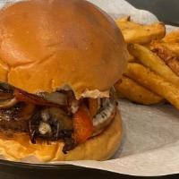 Royal Burger · Sautéed onions, peppers & mushrooms topped with melted Swiss cheese.