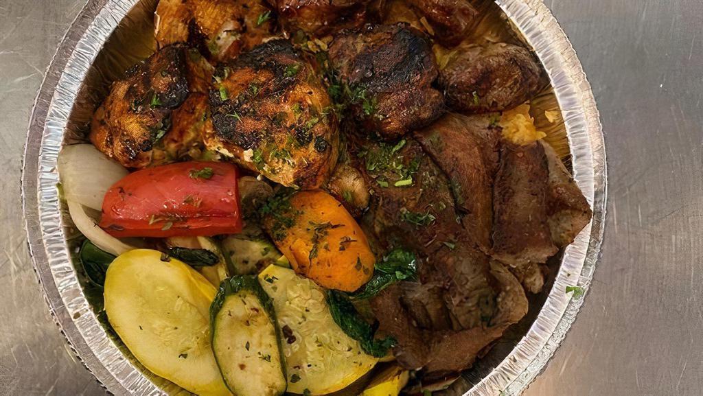 Mix Grill Entree · Mix of 3 kinds of meat; Chicken Kabob pieces, Beef Kabob pieces & Classic Gyro Meat (Beef & Lamb Mixture). Served with basmati rice, our grilled vegetable mix, pita bread, side salad & dipping sauces Taziki, Sesame seed sauce Tahini , and homemade hot sauce.