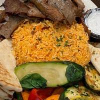 Gyro  Entree · Your choice of Classic or Chicken Gyro served with basmati rice, our grilled vegetable mix, ...