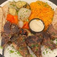 Steak Fajita Entree · Served with basmati rice, our grilled vegetable mix, pita bread, dipping sauce and side salad