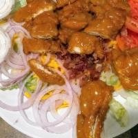 Carolina Salad · Salad topped with chicken tenders dipped in Carolina gold BBQ sauce, blue cheese crumbles, b...