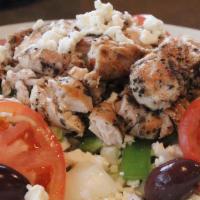 Greek Salad With Chicken Souvlaki · Salad topped with tomato, onion, feta cheese, greek olives, green peppers and our homemade c...
