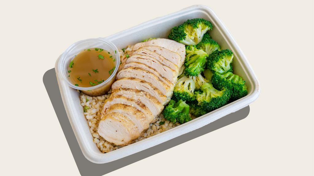 Lean & Clean Protein Plate · Gluten-free*. Grilled free-range chicken breast, brown rice with green onion, steamed broccoli, bone broth and herb sauce.