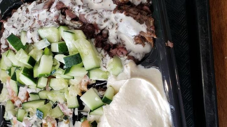Lamb Shawarma Platter · Thinly sliced lamb off our shawarma donor, served over rice or salad, with your choice of 3 sides