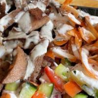Chicken Shawarma Platter · thinly sliced chicken off our shawarma donor, served over rice or salad, with your choice of...