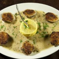Baked Clams Oreganato · Littleneck clams, toasted breadcrumbs and garlic butter.