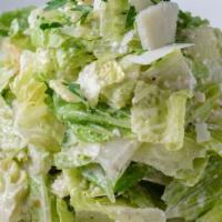 Classic Caesar · Romaine lettuce, parmigiano cheese and garlic croutons.