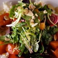 Roasted Beets · Goat cheese, citrus, toasted almonds, sun dried tomato vinaigrette