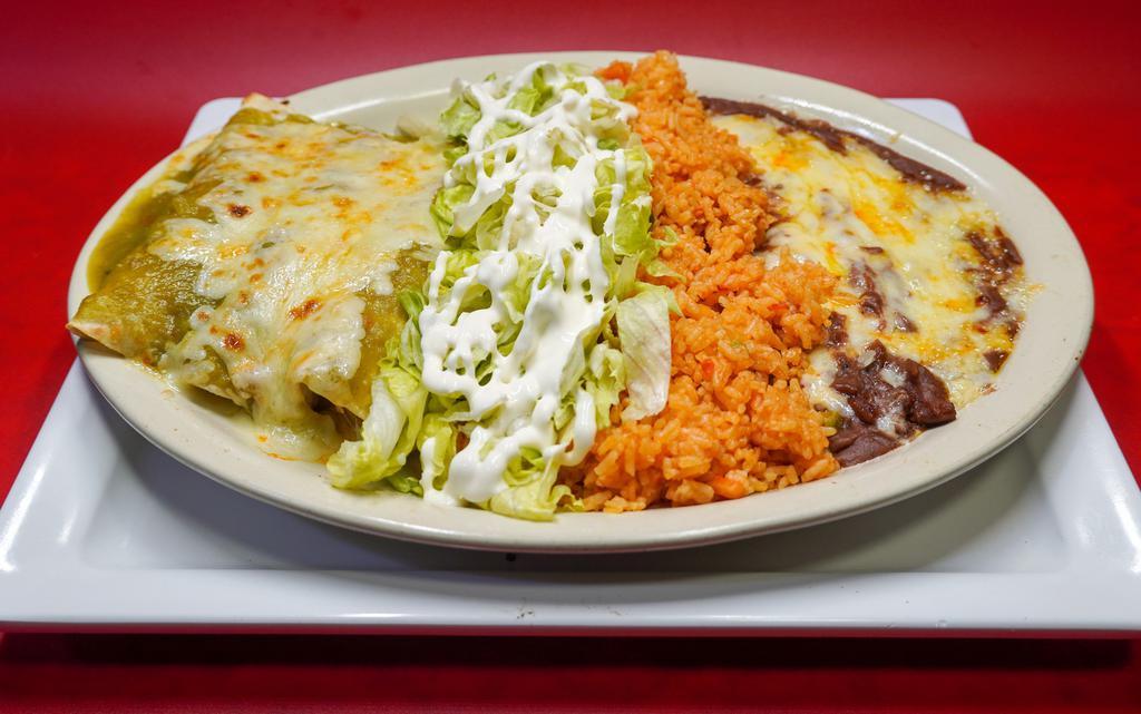 Enchiladas Suizas · Authentic enchiladas with your choice of filling prepared with a sauce of tomatillo, green peppers, onions and spices topped with sour cream.