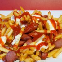 Salchipapas · French fries with a hot dog.