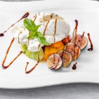 Burrata · Baby heirloom tomatoes, figs in a balsamic reduction, basil and a touch of honey.