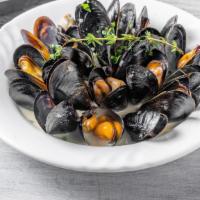 Mussels · White sauce or tomato sauce served with French fries.