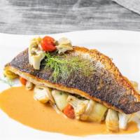 Fillet Of Branzino · Fennel, cherry tomatoes, artichokes, capers, red bliss potatoes in a charred tomato sauce.