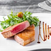 Pan Seared Tuna · Arugula, fennel, peppers, shallot dressing, balsamic reduction.
