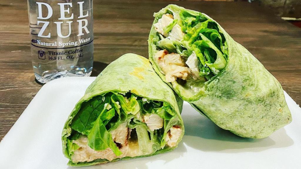 Grilled Chicken Caesar Wrap · Romaine lettuce, Parmesan cheese, our famous Caesar dressing.