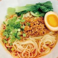 Tantanmen · Thin straight noodles in spicy sesame paste with ground pork, egg, bok choy and scallion wit...