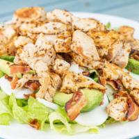 Grilled Chicken Avocado Salad · Radicchio and romaine, tomatoes, cheddar cheese, bacon, hard boiled egg, fresh avocado and g...