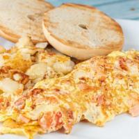 Jerusalem Omelette
 · Lax, diced onions and tomato, served with jumbo toasted bagel with cream sauce. Served with ...