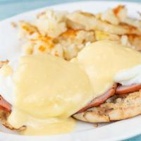 Eggs Benedict
 · Two poached eggs with Canadian bacon on a toasted English muffin topped with Hollander sauce...