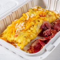 Bacon Cheddar Omelet · Eggs, choice of bacon and cheddar cheese.