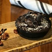 Brownie Skillet · House-baked Brownie topped with Chocolate Peanut Butter Ice Cream served with side of Candie...