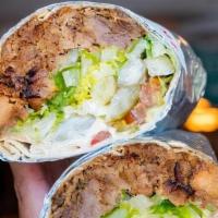 Carnitas Shawarma Wrap · Slow-roasted smoked pork, lettuce, tomato, house-pickled jalapeno, cilantro + chipotle salsa