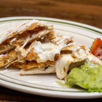 Regular Quesadilla (12 Inch) · Flour tortilla filled with favorite meat, cheese topped with sour cream, guacamole and cotij...