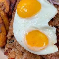 Tacu Tacu A Lo Pobre  (Best In Town) · Pan fried rice and beans served with steak, fried eggs, sweet plantains and salsa criolla.