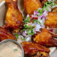 Wings A La Limeña (Best In Town) · Aji panca marinated chicken wings served with blue cheese acholado.