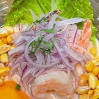 Shrimp Ceviche · Chilled shrimp ceviche marinated in our aji limo leche de tigre accompanied with choclos per...