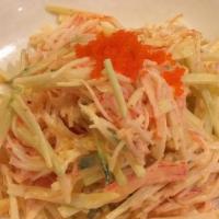Kani Salad · Crab meat salad, cucumber, kani, spicy mayo, masago and sesame.